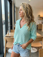 New women's collared knit sweater with three-quarter sleeves and solid color