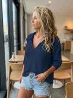 New women's collared knit sweater with three-quarter sleeves and solid color